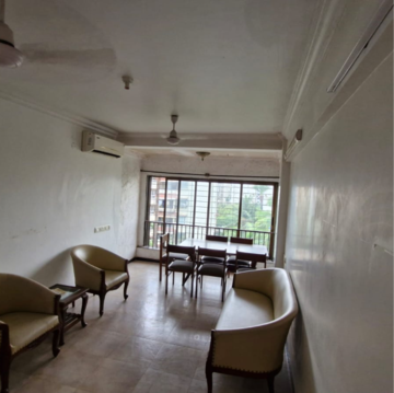 Living Room in 1 BHK Apartment at Gold Crown, Seven Bunglow – for Sale