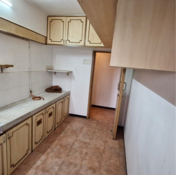 Kitchen in 1 BHK Apartment at Gold Crown, Seven Bunglow – for Sale