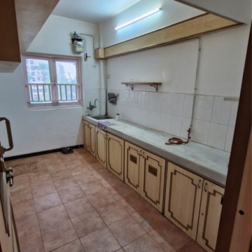 Kitchen in 1 BHK Apartment at Gold Crown, Seven Bunglow – for Sale