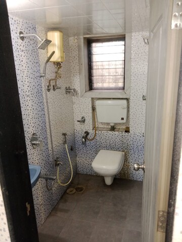 Bathroom in 1 BHK Apartment at Shreeji Tower, Panchsheel Nagar – for Rent