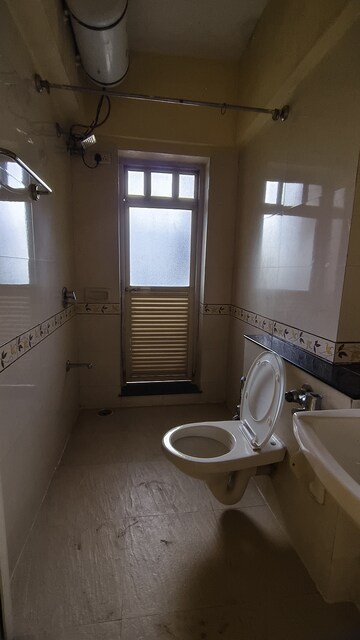 Bathroom in 1 BHK Apartment at K Raheja Heights, Malad East – for Rent