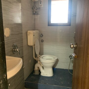 Bathroom in 2 BHK Apartment at Krishna Classic, Babhai Naka – for Rent