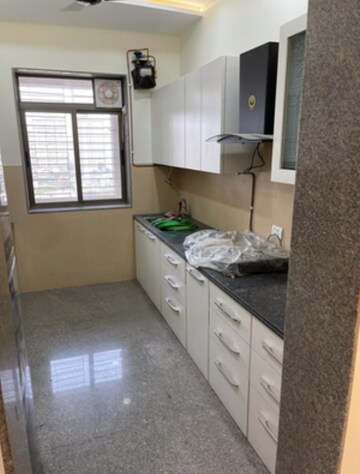 Kitchen in 3 BHK Apartment at Kalpataru Siddhachal Elite, Vasant Vihar – for Rent