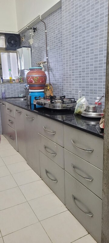 Kitchen in 2.5 BHK Apartment at NRI Complex Phase 2, Seawoods – for Rent