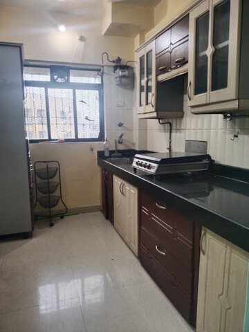Kitchen in 2 BHK Apartment at RK Cosmos CHS, Thane West – for Rent