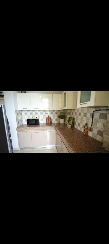 Kitchen in 3 BHK Apartment at AFOWO Raksha Addela, Sector 16c Greater Noida – for Sale