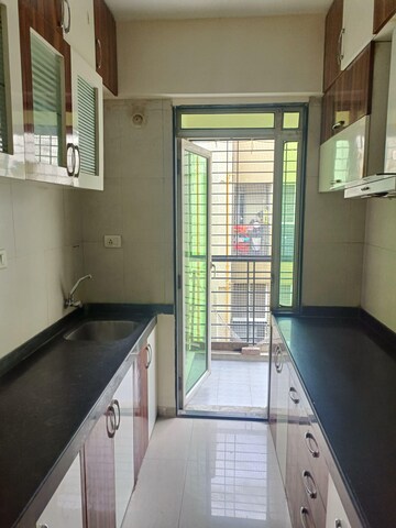 Kitchen in 2 BHK Apartment at Dheeraj Jade Residences, Wagholi – for Rent