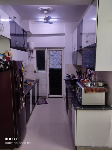 Kitchen in 4 BHK Apartment at Amrapali Crystal Homes, Sector 76 – for Sale