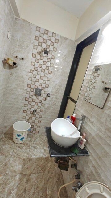 Attached Bathroom in 1 BHK Apartment at Bhoomi Acres, Waghbil – for Rent