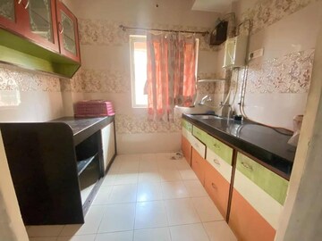 Kitchen in 1 BHK Apartment at Unnathi Woods Phase 1 And 2, Ghodbunder Road – for Rent