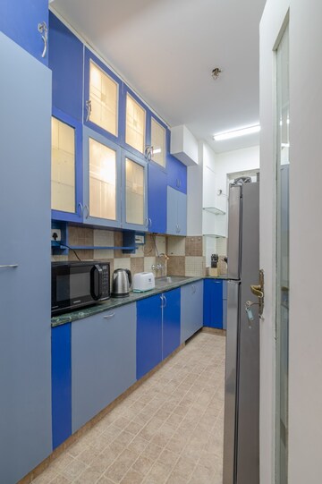 Kitchen in 4 BHK Apartment at DLF The Belvedere Park, Sector 24 – for Rent