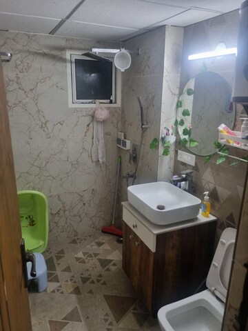 Bathroom in 2 BHK Apartment at Aims Golf City, Sector 75 – for Rent