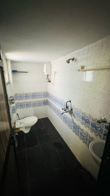 Bathroom in 2 BHK Apartment at New Nikita Apartments, Borivali West – for Rent