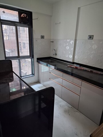 Kitchen in 2 BHK Apartment at Wadhwa TW Gardens, Kandivali East – for Rent
