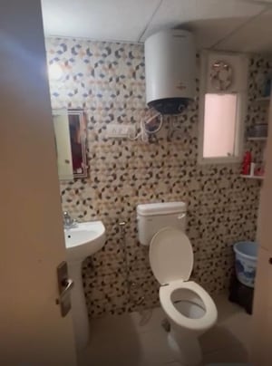 Bathroom in 3 BHK Apartment at Mehak Jeevan, Raj Nagar Extension – for Sale