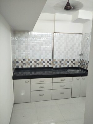 Kitchen in 1 BHK Apartment at Cosmos Orchid, Ghodbunder Road – for Sale