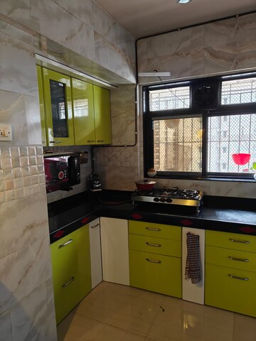 Kitchen in 1 BHK Apartment at Raunak Unnathi Greens, Kasarvadavali – for Sale