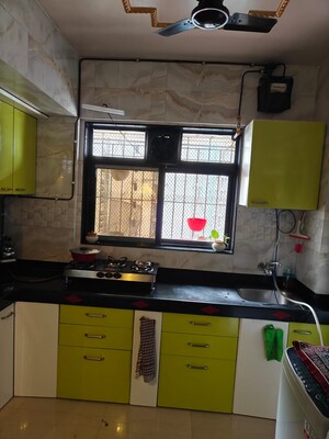 Kitchen in 1 BHK Apartment at Raunak Unnathi Greens, Kasarvadavali – for Sale