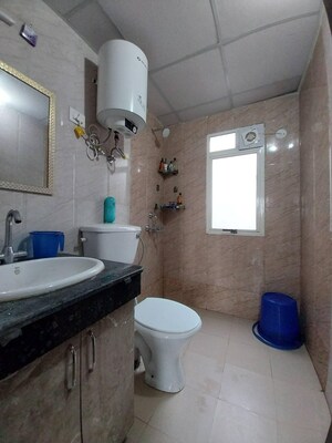 Bathroom in 2 BHK Apartment at Nimbus The Park Street, Chi V Greater Noida – for Sale
