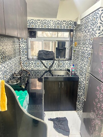 Kitchen in 1 BHK Apartment at Montana CHS, Andheri West – for Sale