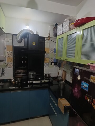 Kitchen in 1 BHK Apartment at Raunak Heights, Ghodbunder Road – for Sale