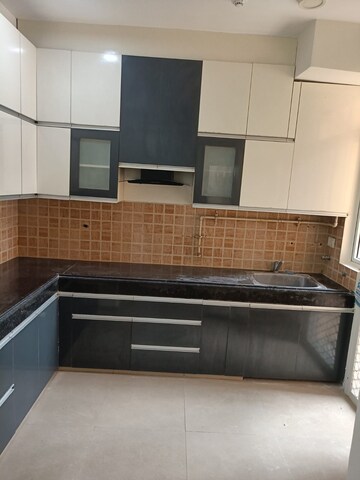 Kitchen in 2 BHK Apartment at Mahagun Mywoods, Sector 16c Greater Noida – for Rent
