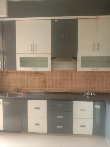 Kitchen in 3 BHK Apartment at Mahagun Mywoods, Sector 16c Greater Noida – for Rent