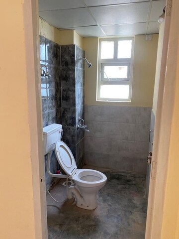 Bathroom in 1 BHK Apartment at Auric City Homes, Sector 82 – for Rent