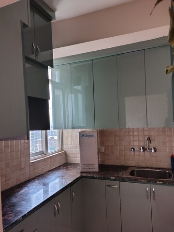 Kitchen in 2 BHK Apartment at Amrapali Dream Valley, Tech Zone 4 Greater Noida – for Rent