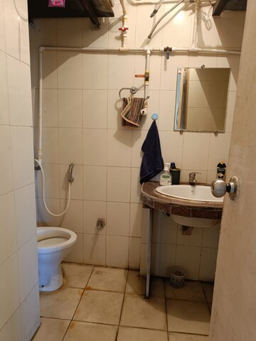 Bathroom in 1 BHK Apartment at Royal Palms Garden View, Goregaon East – for Rent