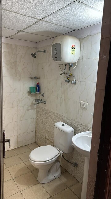 Bathroom in 2 BHK Apartment at Aims Golf City, Sector 75 – for Rent
