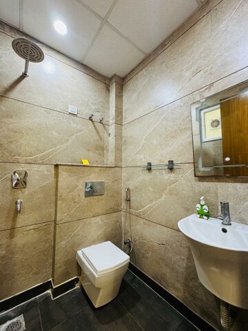 Bathroom in  Office Space at Aarcity Krishna Apra D Mall, Shakti Khand 2 – for Rent