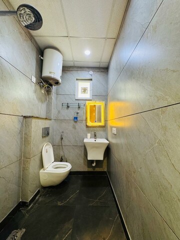 Bathroom in  Office Space at Aarcity Krishna Apra D Mall, Shakti Khand 2 – for Rent