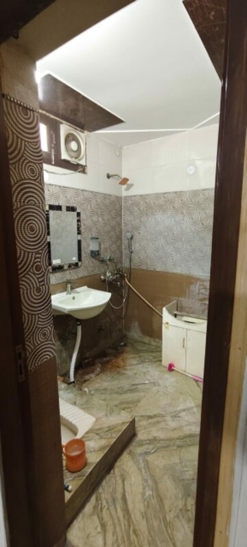 Bathroom in 4 BHK Builder Floor at Soho Awas Apartments, Gyan Khand I – for Rent