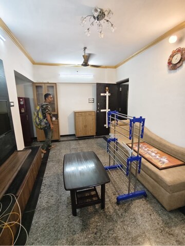 Living Room in 1 BHK Apartment at Dheeraj Uphar CHS. LTD., Malad East – for Rent