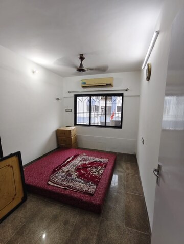 Bedroom in 1 BHK Apartment at Dheeraj Uphar CHS. LTD., Malad East – for Rent