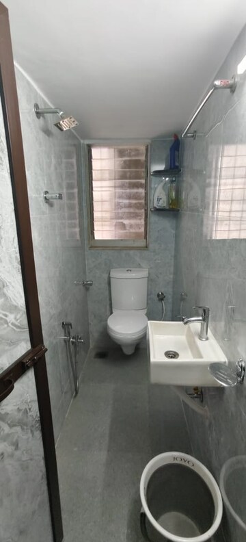 Bathroom in 1 BHK Apartment at Dheeraj Uphar CHS. LTD., Malad East – for Rent