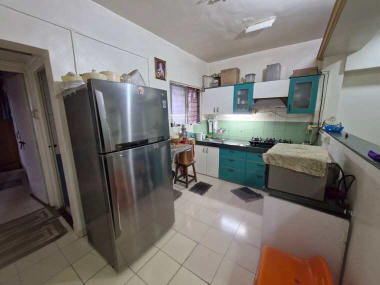 Kitchen, karan-ashiyana 2 Bedroom 813 Sq.Ft. Apartment In Wadgaon Sheri Pune 9111926