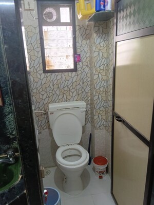 Bathroom in 1 BHK Apartment at Om Sagar Shantinagar CHS, Mira Road – for Sale