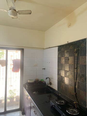 Kitchen in 1 BHK Apartment at Raunak Heights, Ghodbunder Road – for Rent