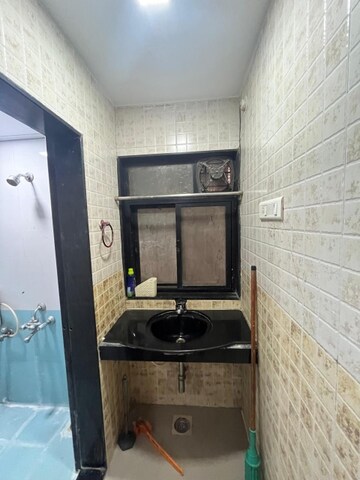 Bathroom in 1 BHK Apartment at Jagrut CHS, Gokhalenagar – for Rent