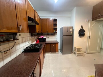 Kitchen in 3 BHK Apartment at Chartered Court, Richmond Road – for Rent