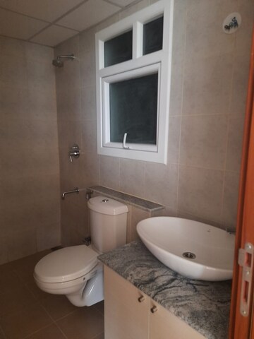 Bathroom in 1 BHK Apartment at Bhartiya Nikoo Homes Phase 2, Thanisandra Main Road – for Sale
