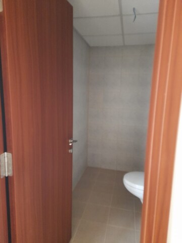 Bathroom in 1 BHK Apartment at Bhartiya Nikoo Homes Phase 2, Thanisandra Main Road – for Sale