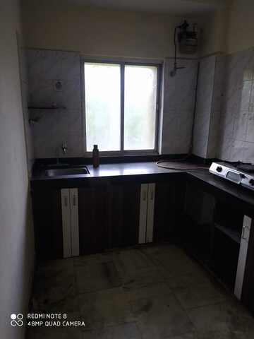 Kitchen in 2 BHK Apartment at Riddhi Gardens CHS, Malad East – for Rent