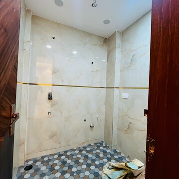 Bathroom in 4 BHK Builder Floor at Hargobind Enclave – for Sale