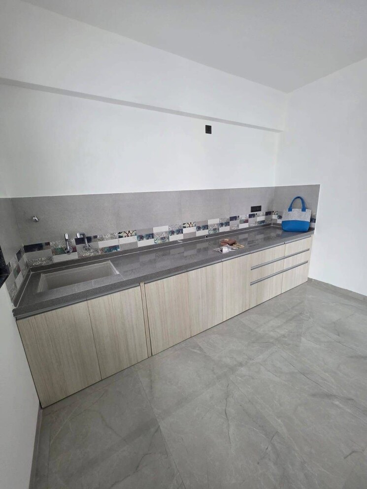 Kitchen, unique-youtopia 2 Bedroom 850 Sq.Ft. Apartment In Kharadi Pune 9120710