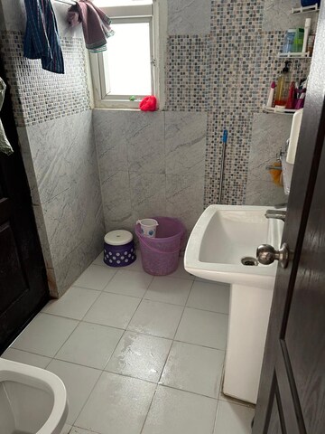 Bathroom in 2.5 BHK Apartment at Aims Golf City, Sector 75 – for Rent