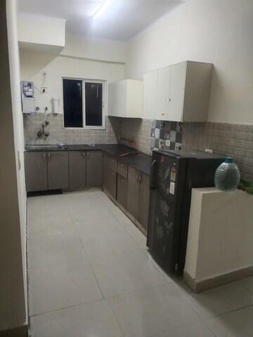Kitchen in 2.5 BHK Apartment at Aims Golf City, Sector 75 – for Rent