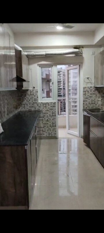 Kitchen in 3 BHK Apartment at Samridhi Grand Avenue, Tech Zone 4 Greater Noida – for Rent